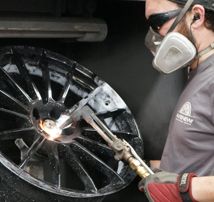 man fixing wheel